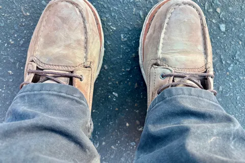 Work boots on asphalt