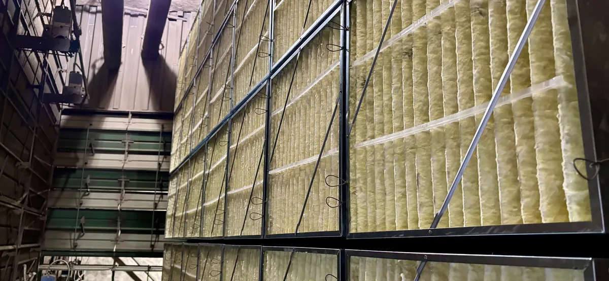 Wall of fiberglass filters in an industrial plant air handler