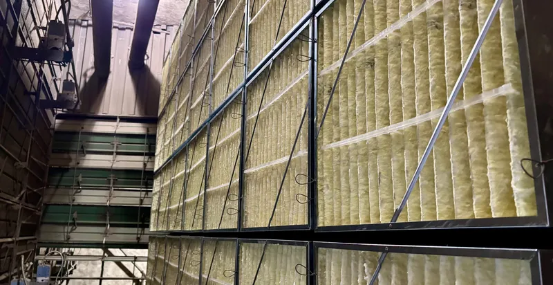 Wall of fiberglass filters in an industrial plant air handler